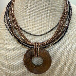Cookie Lee Multi-Strand Brown Glass Bead Necklace W/ Acrylic Circle Pendant Boho